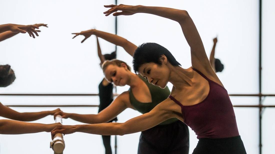 Ballet dancers at the bar at a ballet level 2 class